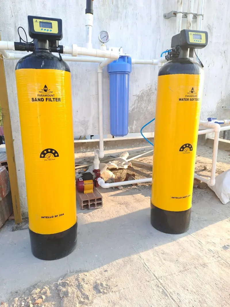 Sand filter and water softener installed side by side